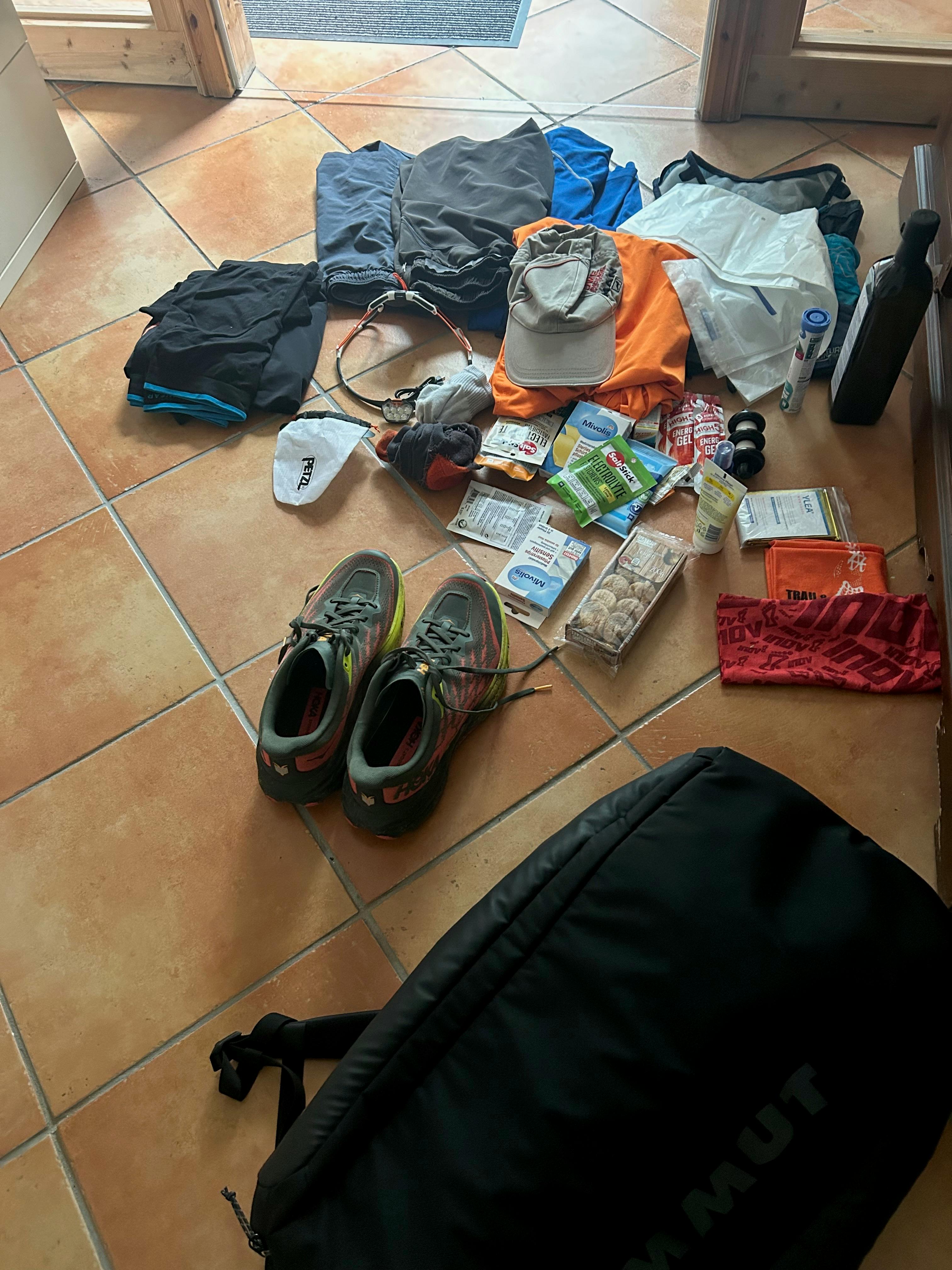 A picture of running gear scattered on the floor