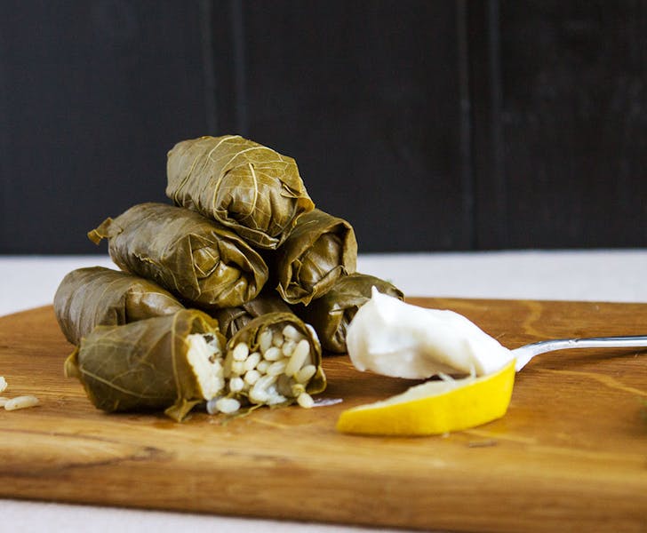 Dolmades are traditional grape leaves stuffed with rice