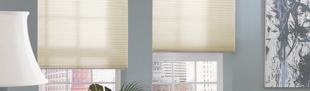 off-white pleated shades in a living room
