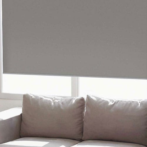 blackout roller shade behind couch