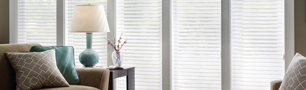 white wood blinds in a living room