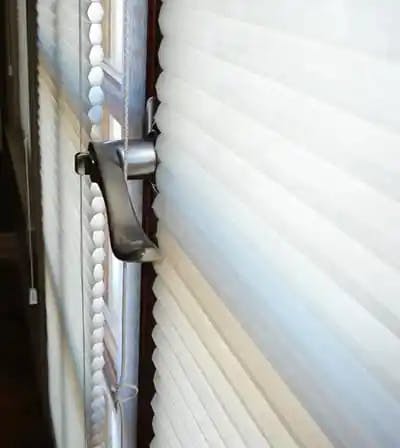 cellular shades installed behind handle on french door