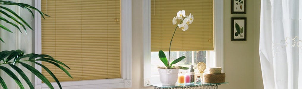 yellow mini blinds in a bathroom