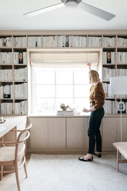 opening linen roman shades in library