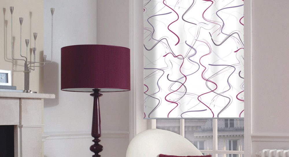 White shade with a purple design along a purple accent lamp in a living room
