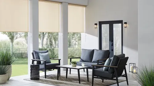 outdoor solar shades half open on patio