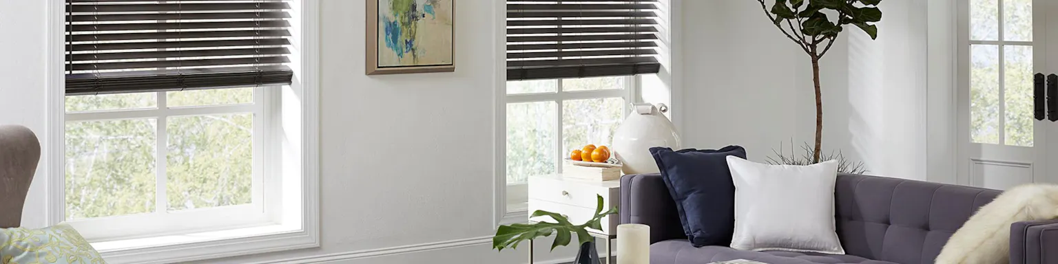 dark wood blinds against a white wall in a bright living room