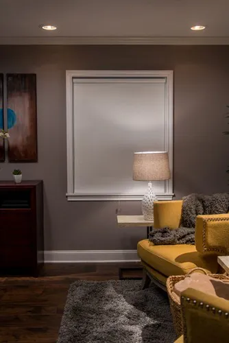 white blackout roller shade closed in living room