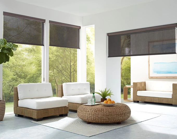 coolaroo brand outdoor shades in dark grey on a white exterior patio