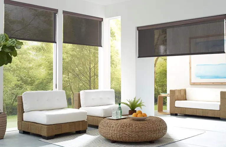coolaroo brand outdoor shades in dark grey on a white exterior patio