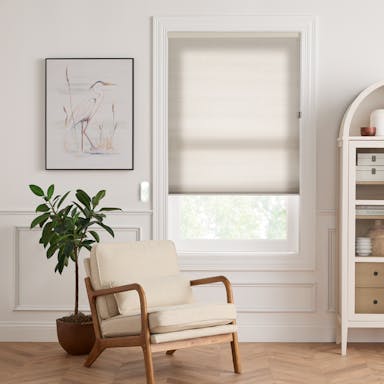 Modern living room with light-filtering cellular shades that provide insulation and a clean, minimalist look.