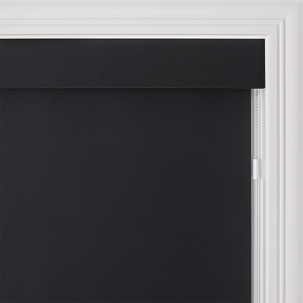 Bright modern room with sleek black roller shades offering smooth light control and privacy