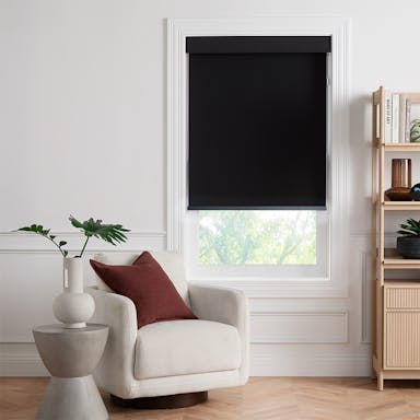 Bright modern room with sleek black roller shades offering smooth light control and privacy
