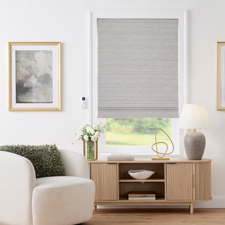 Elegant living space with soft gray Roman shades that add timeless style and sophistication.