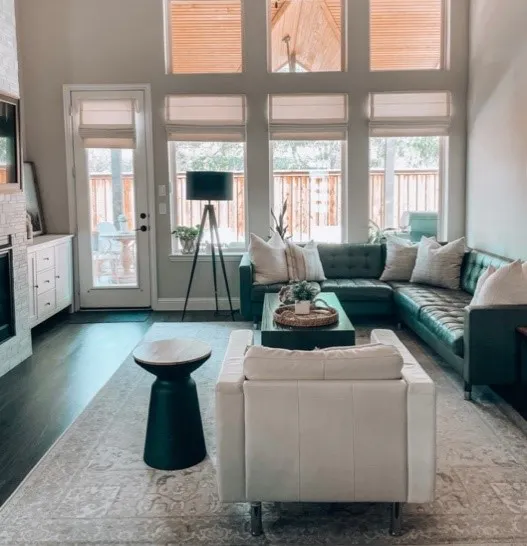 premium roller shades in large living room large windows