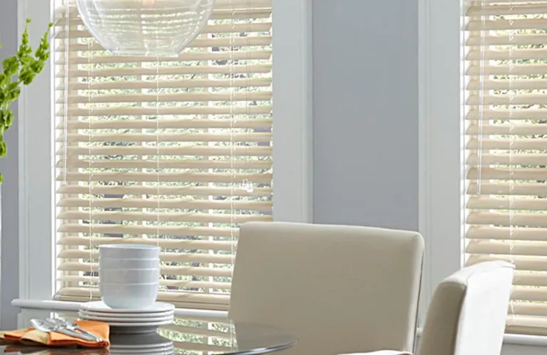 Off-white mini blinds in a bright breakfast nook