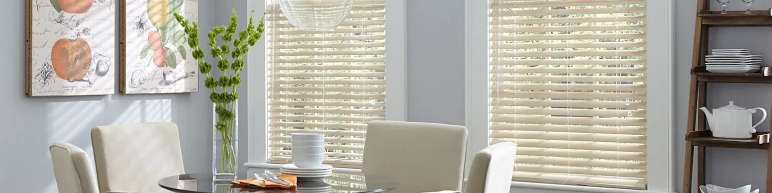 Off-white mini blinds in a bright breakfast nook