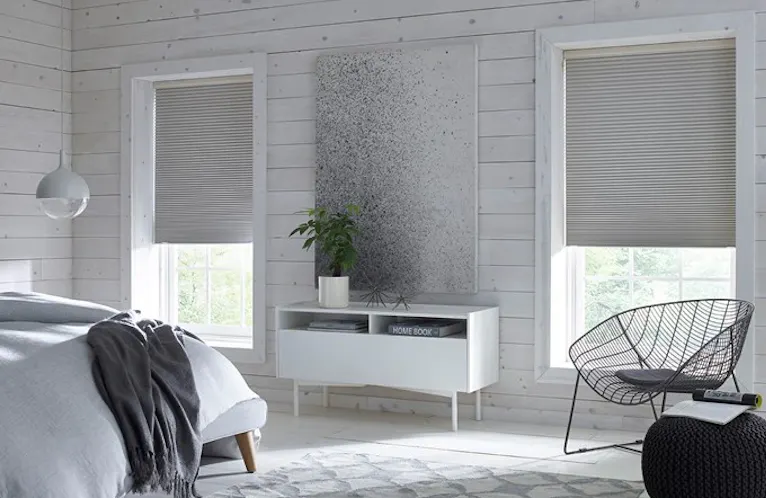 neutral SouthSeas blackout cellular shades in a bright bedroom