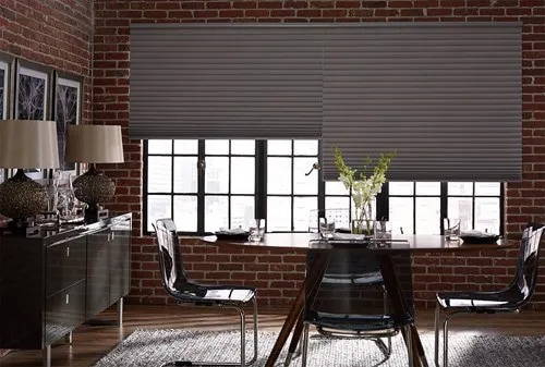blackout cellular shades in brick dining room