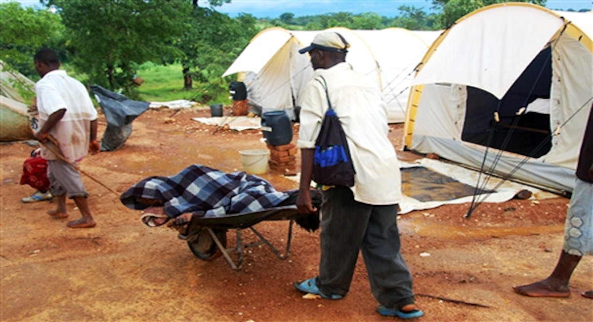 Mashonaland West province, Makonde district, Nyamupamira village. A patient is brought to the cholera treatment unit by relatives.