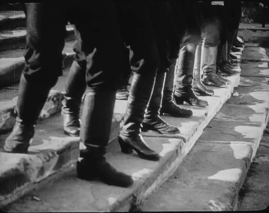 Soldiers' boots descending the Odessa Steps in Battleship Potemkin (1925). Frame from the film, public domain, via Wikimedia Commons.