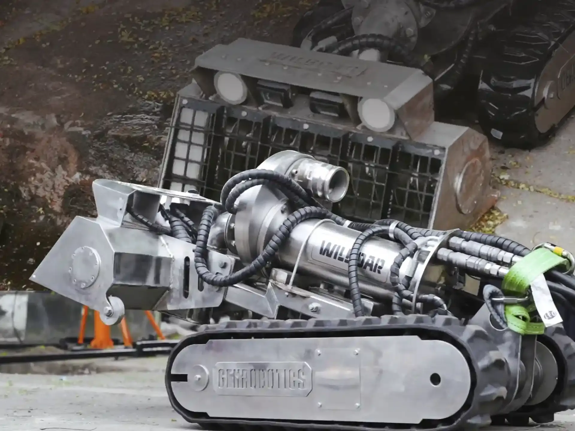 The WilBoar robot performs stormwater and drainage cleaning at Trivandrum International Airport using its tracked system and heavy-duty intake unit.
