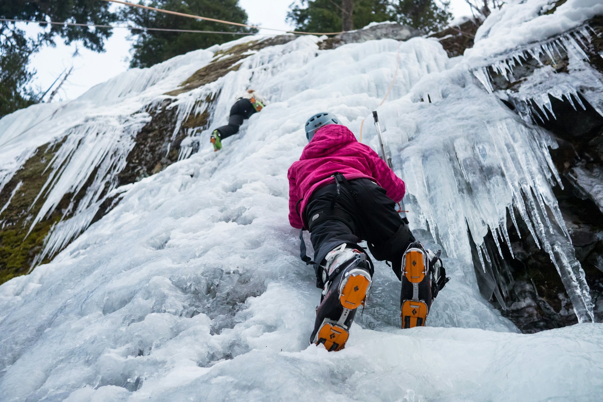A young woman ice climbing in Whistler