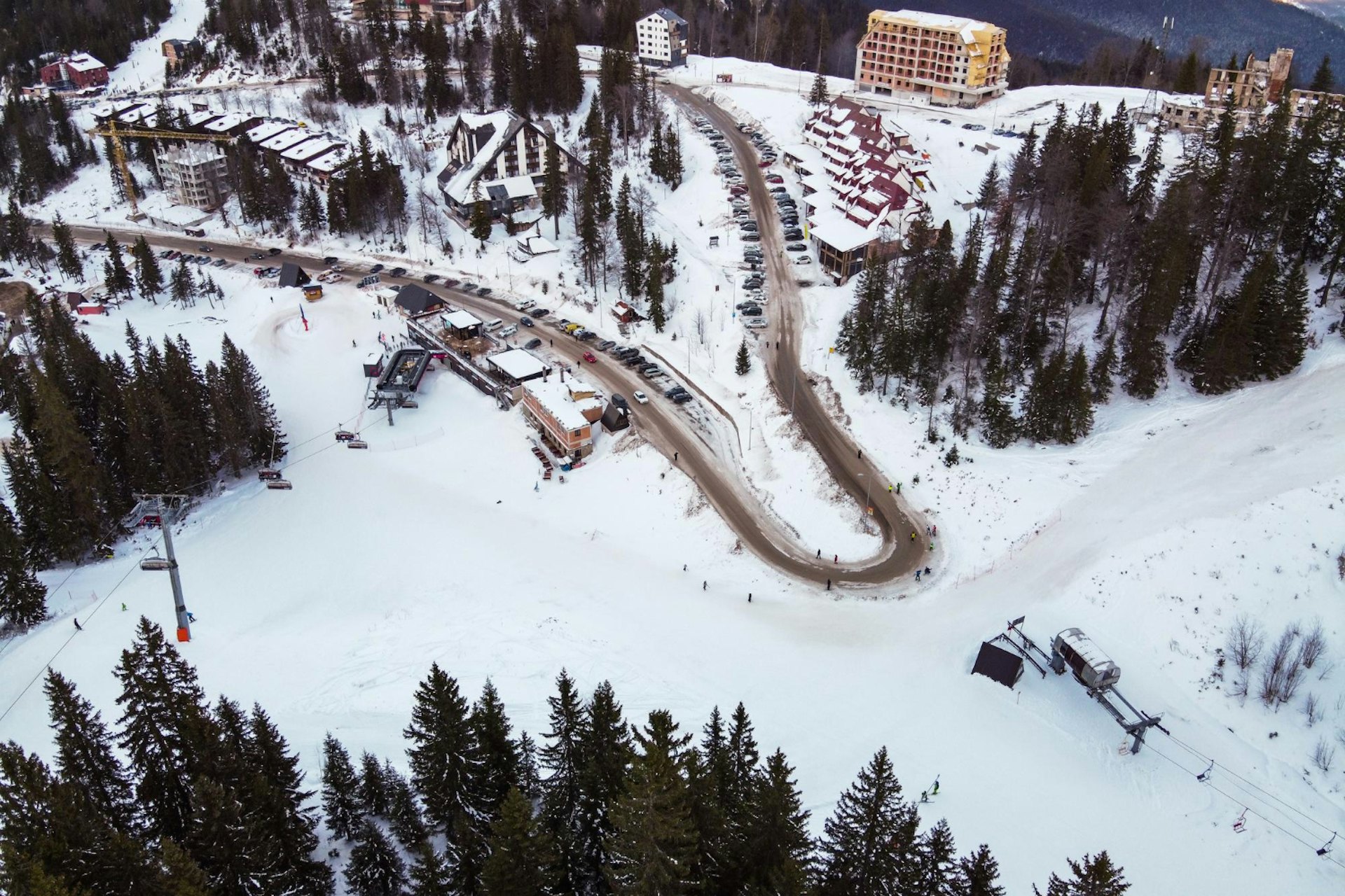 High angle view of people skiing on snow covered land