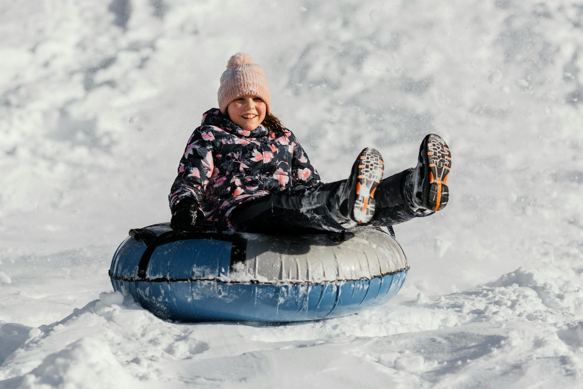 Full shot girl playing in snow