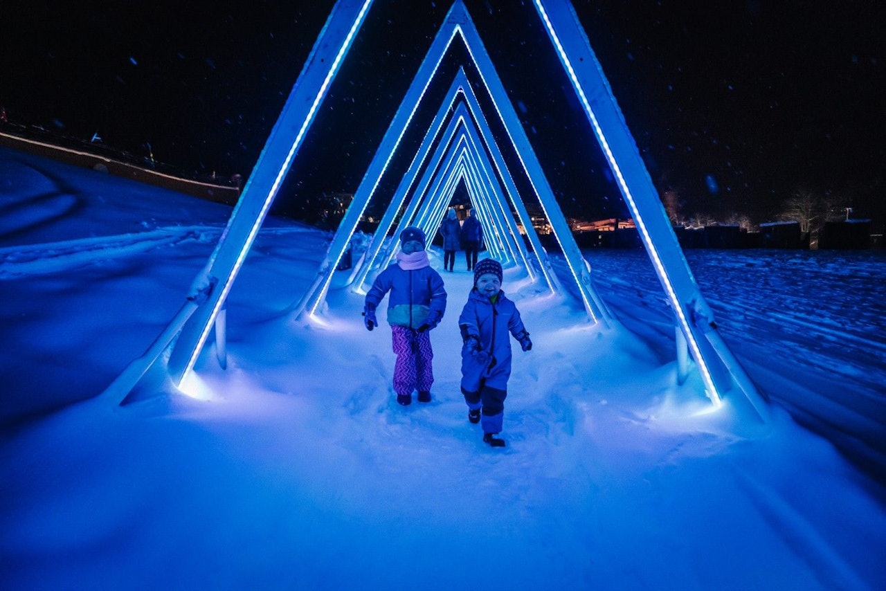 Two children engaging in general snowy merriment at Snowmass in Colorado, USA.