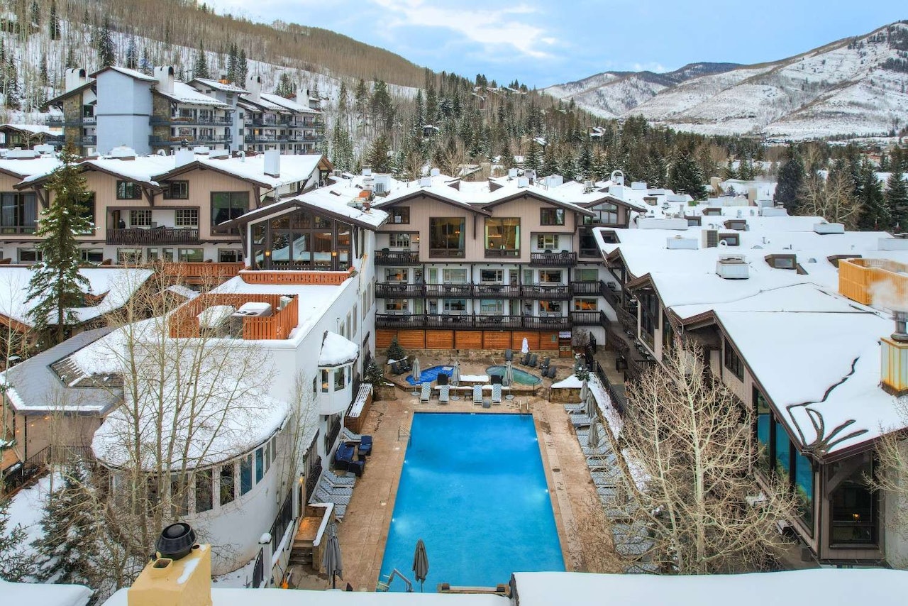 A scenic view of the pool at Vail Resort, surrounded by mountains in Beaver Creek, Colorado.