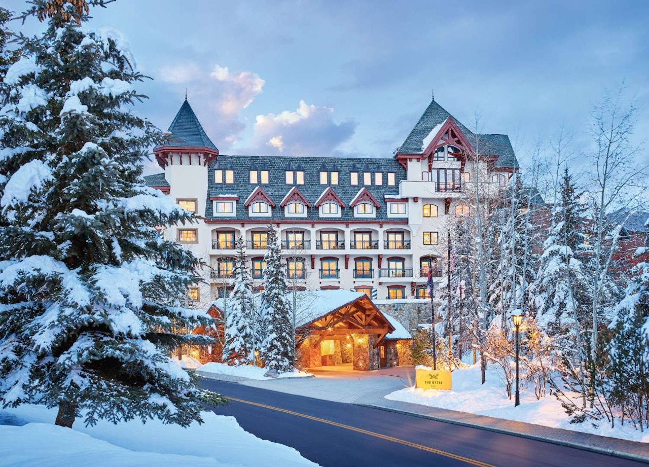St. Mary's Hotel in Breckenridge, Colorado, showcasing its charming architecture against a mountain backdrop.