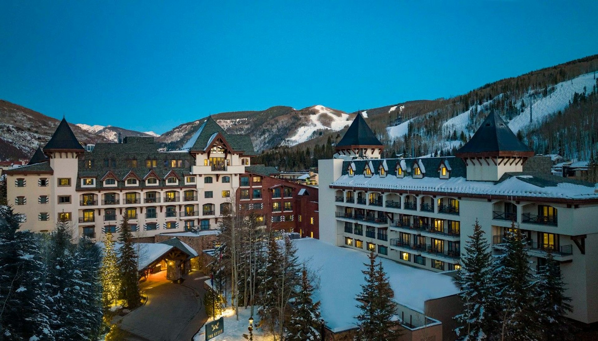 The St. Regis Aspen, a luxury hotel nestled in the mountains, showcasing elegant architecture and stunning alpine views.