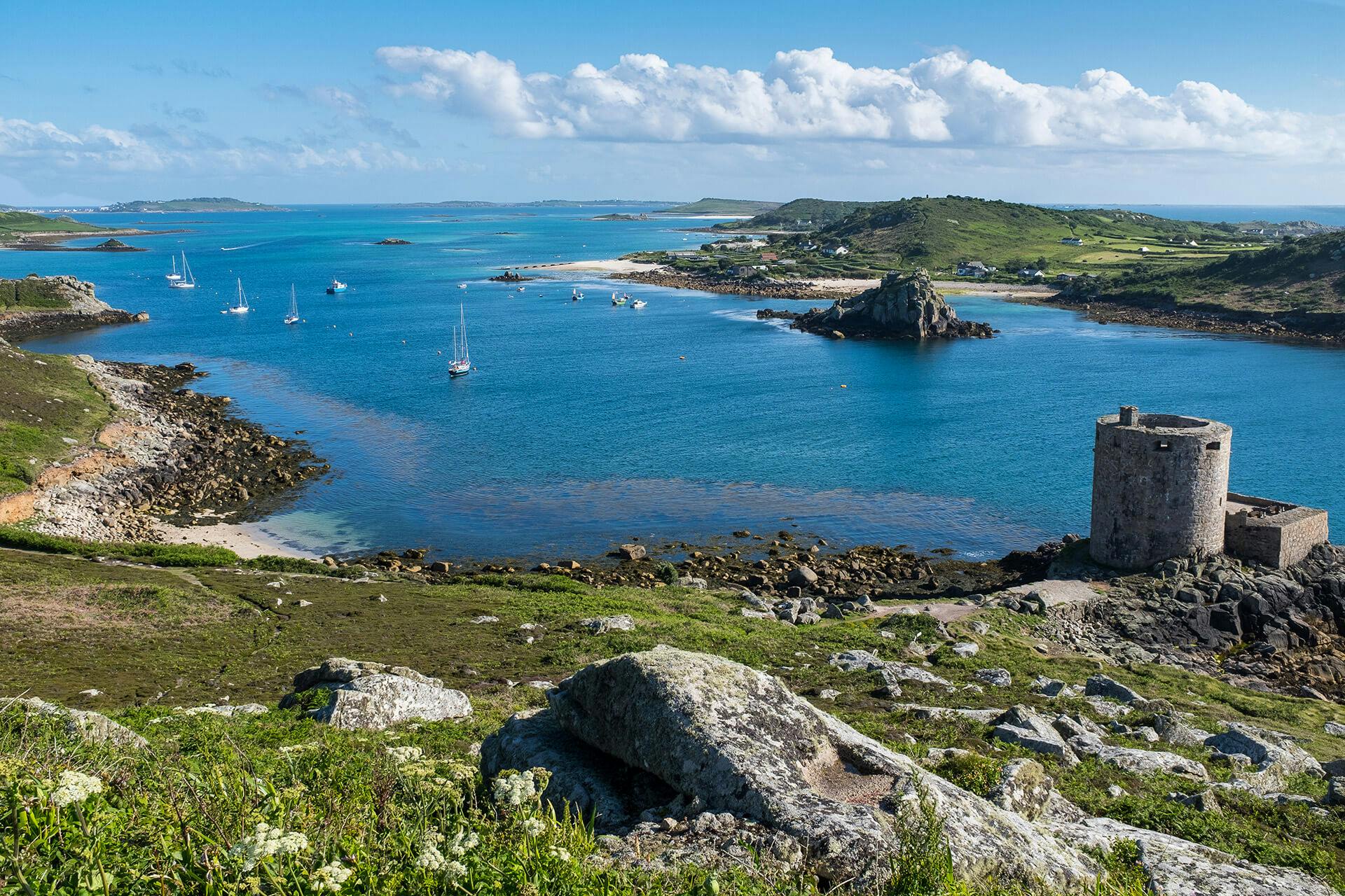 A view of Bryher from Tresco on the Isles of Scilly, with Cromwell's Castle in the foreground