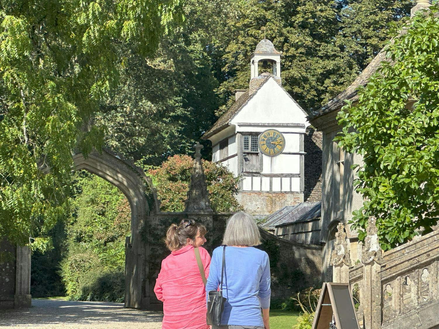 Two women walking in the historic English village, Lacock