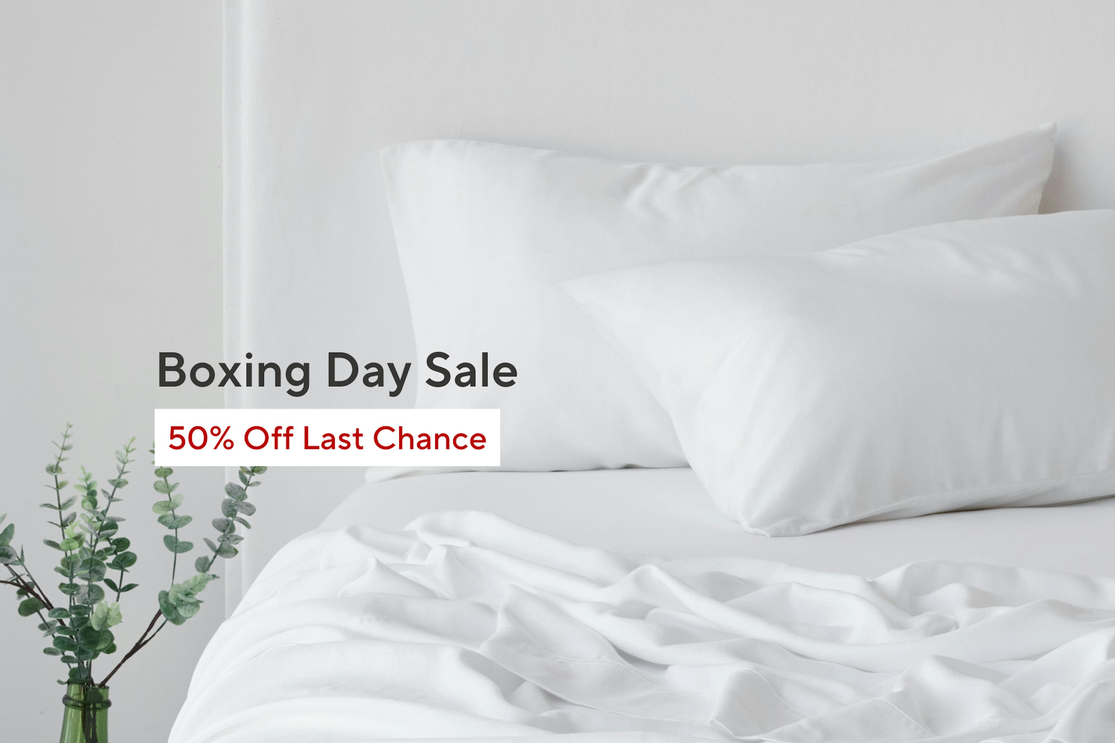 White bed set up with Boxing Day Sale Messaging