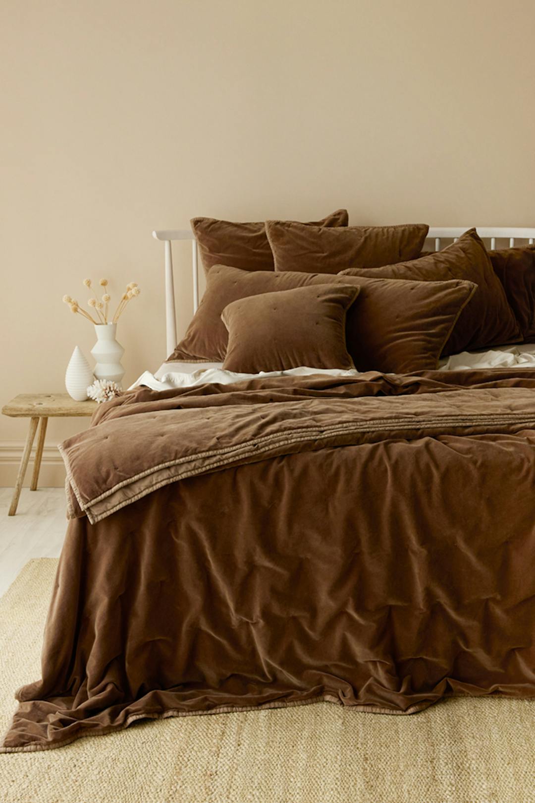 Chocolate brown coverlet on bed