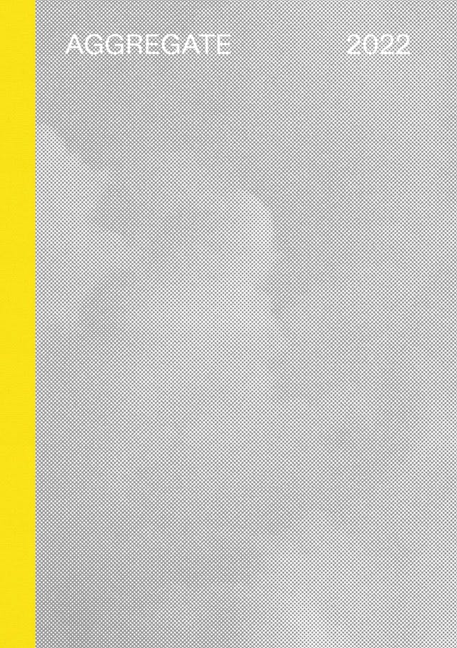 The front of a book. It has a bright yellow spine and grey cover. It is titled Aggregate 2022.