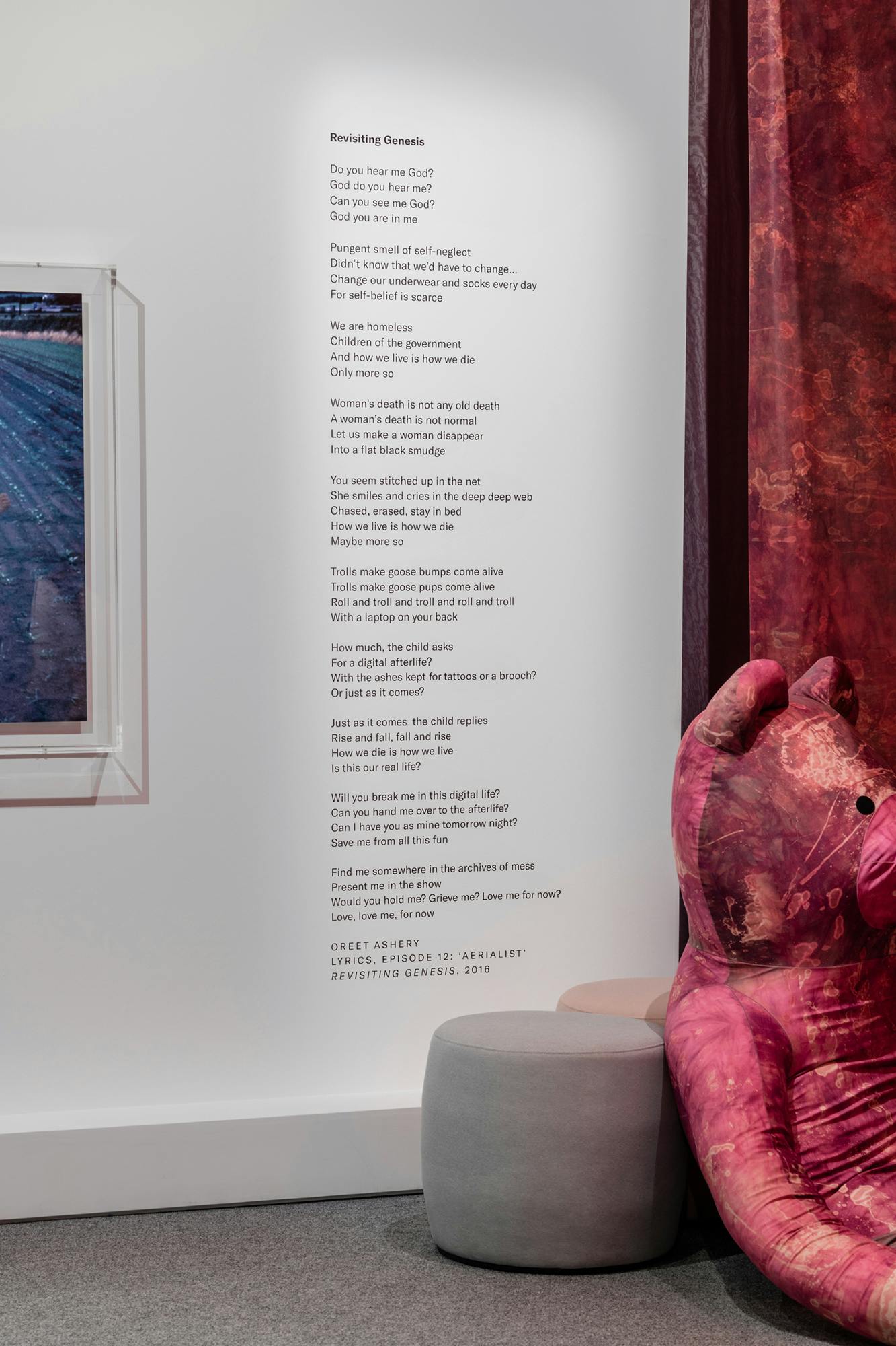 The photograph includes a poem written on the wall.