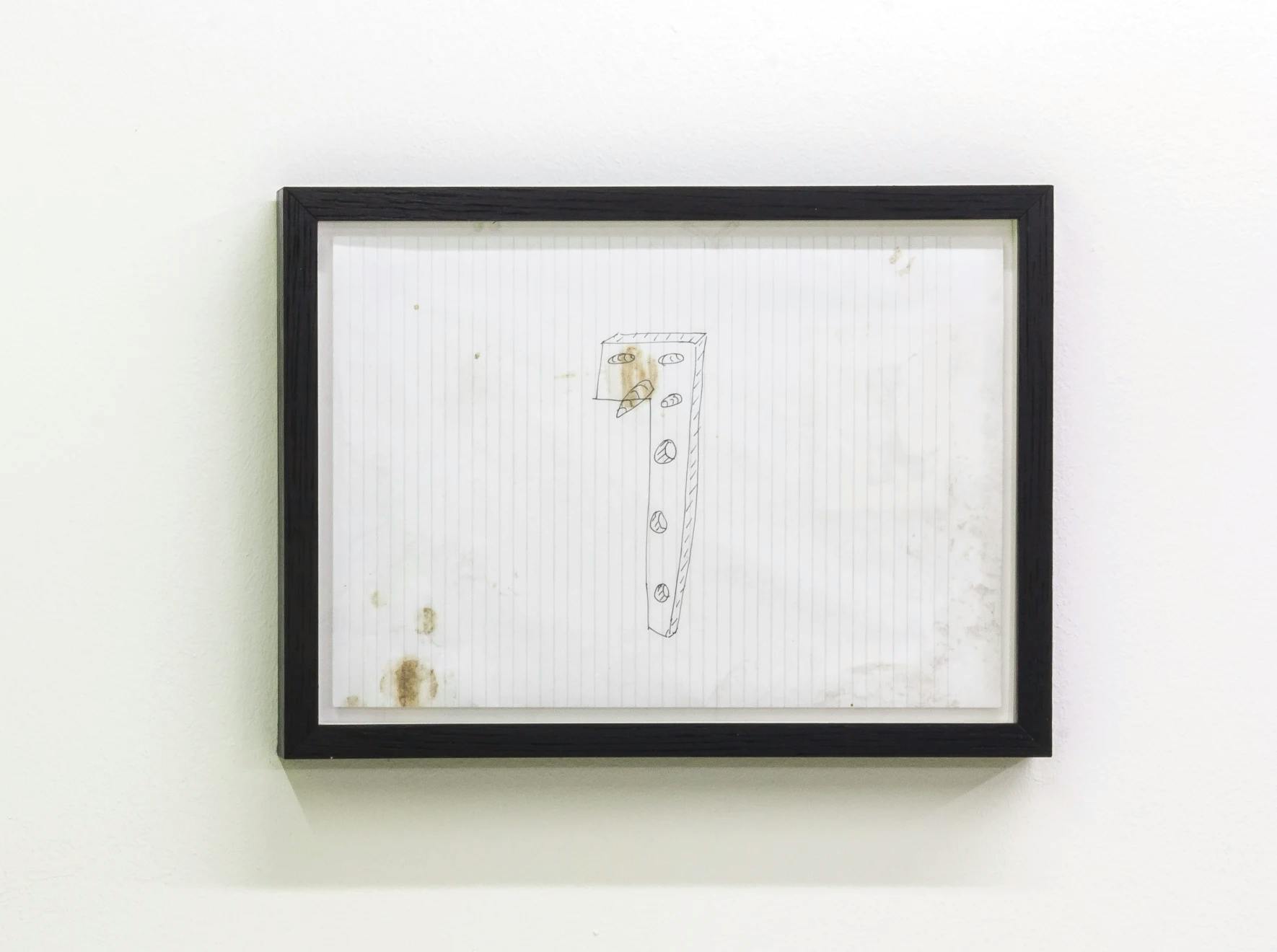 A drawing of a wooden peg with a big nose. The drawing is messy with stains on it.