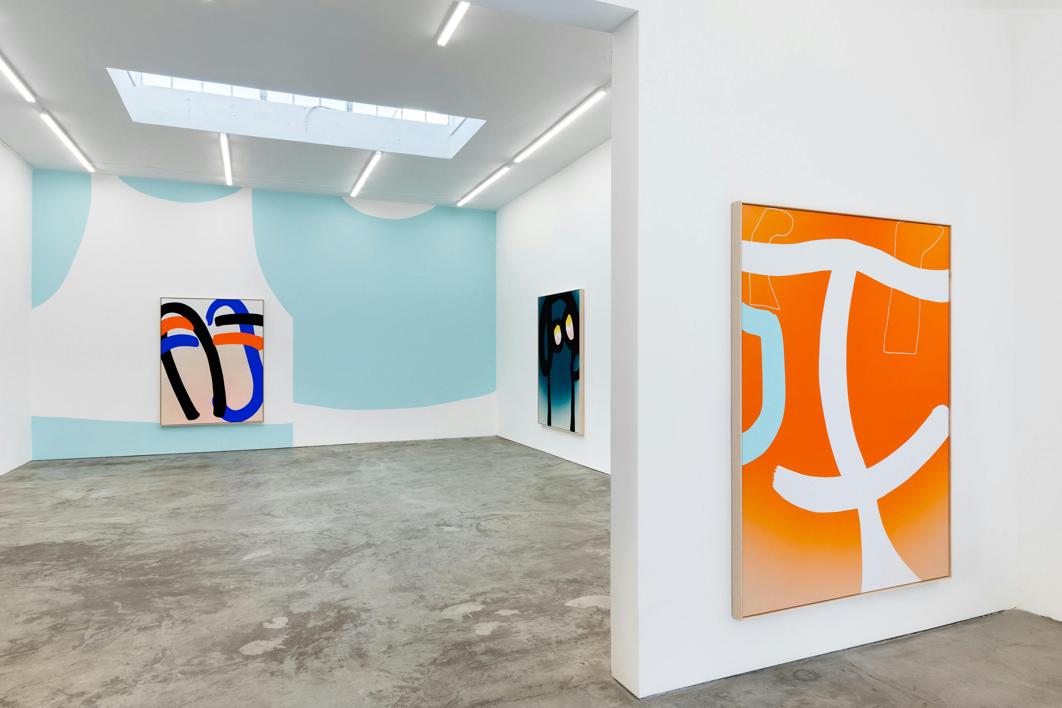 Installation view of brightly coloured semi-abstract paintings. The paintings are large-scale and hint at figures and real life elements that teeter on the edge of abstraction.