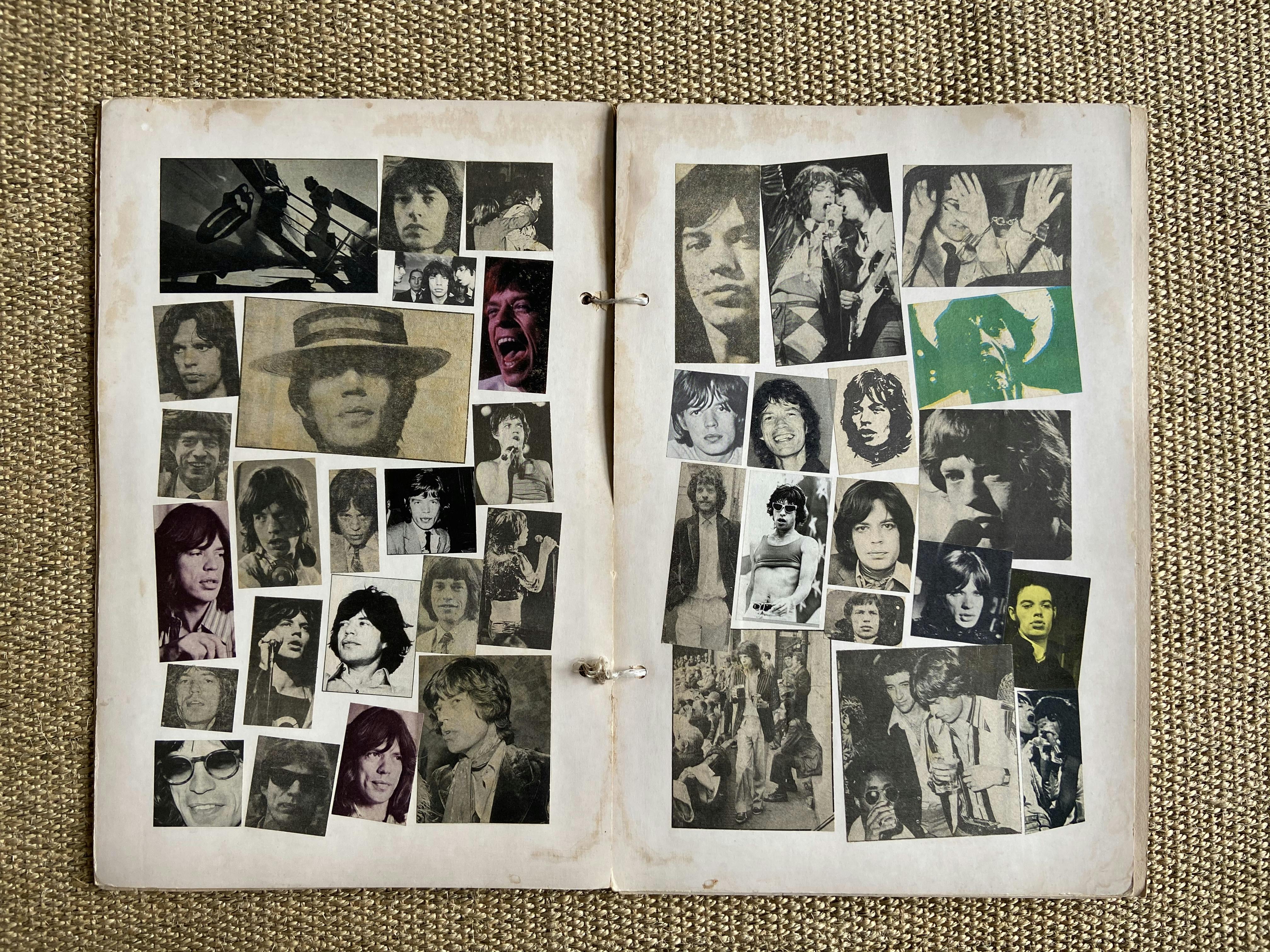 A scrapbook of hand cut newspaper images of the singer Mick Jagger. The paper is yellowed and old and it is held together with some string. 