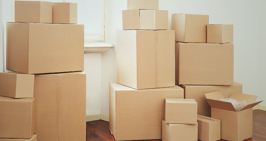 decluttering your home using cardboard boxex