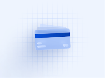 Close-up stack of blue credit cards. A security strip is shown on the top card