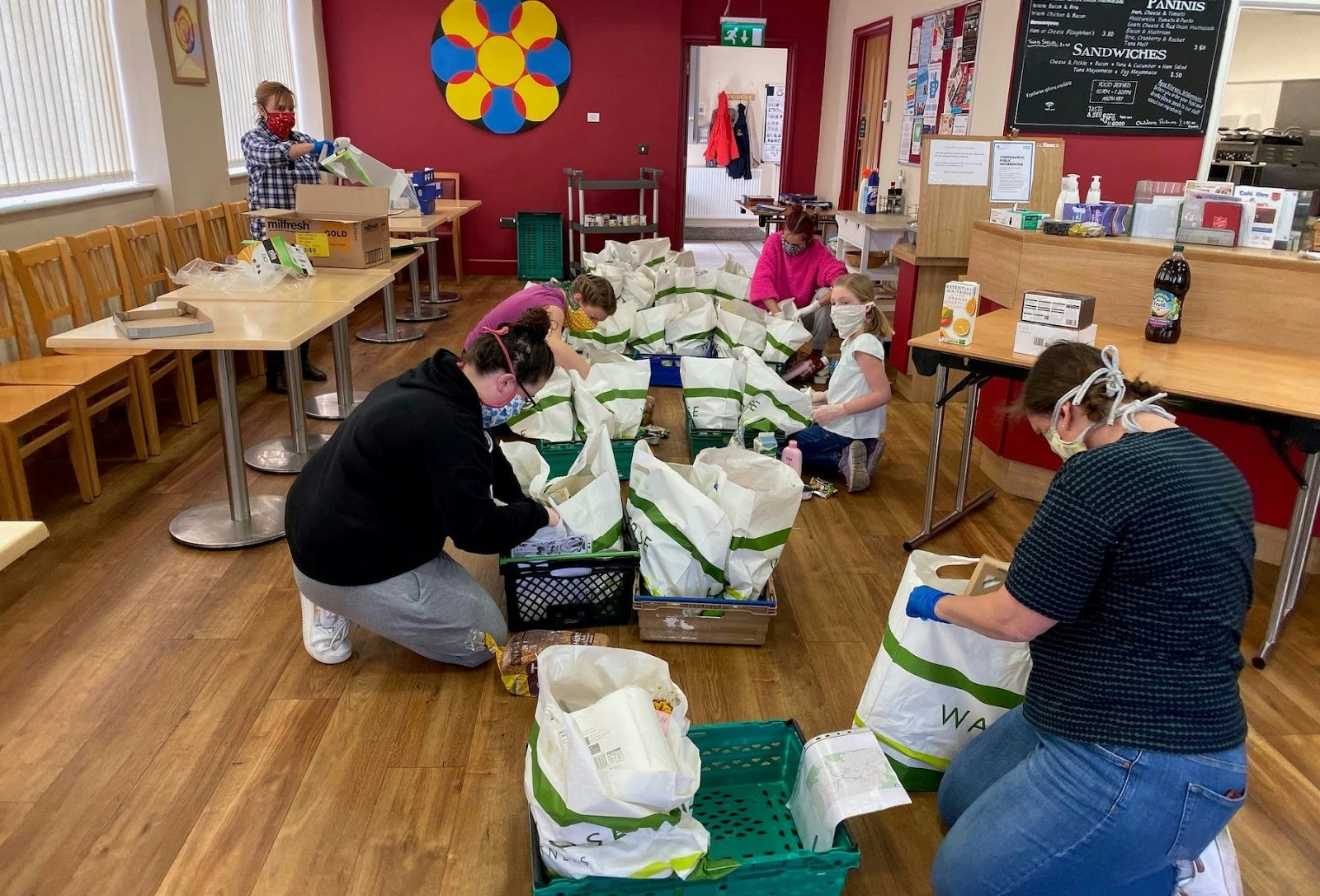The volunteers at Oasis Hub Bath pack up food parcels that are going to be delivered using Circuit's route planning software.