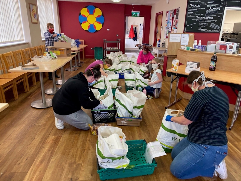 The volunteers at Oasis Hub Bath pack up food parcels that are going to be delivered using Circuit's route planning software.