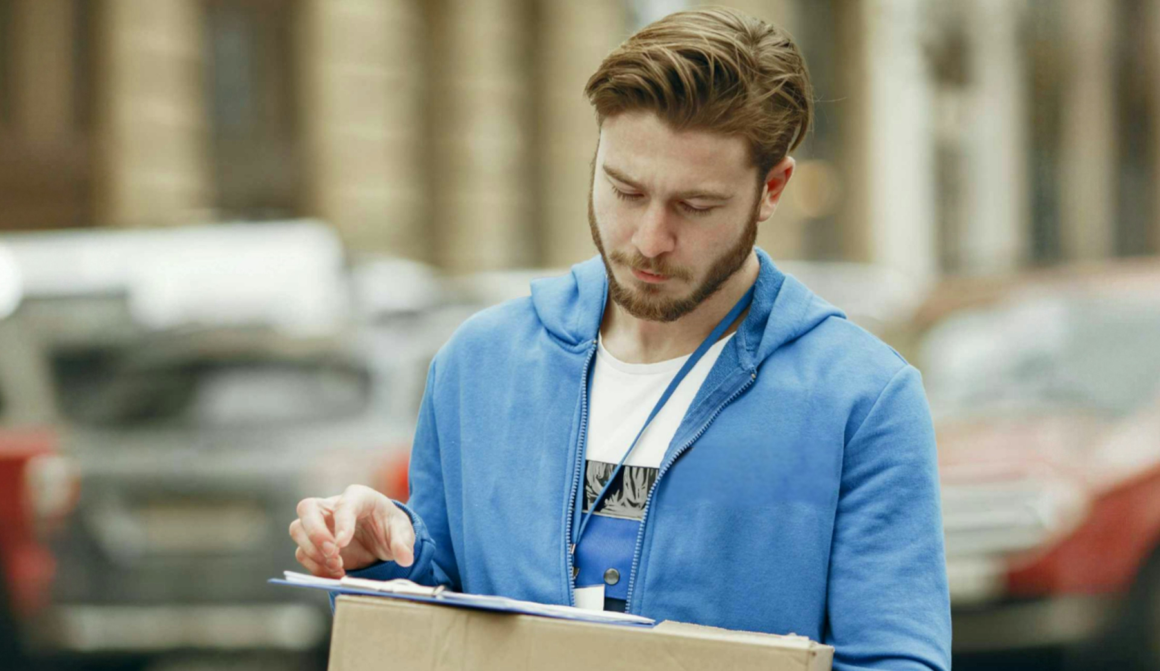 Courier driver reading the contract