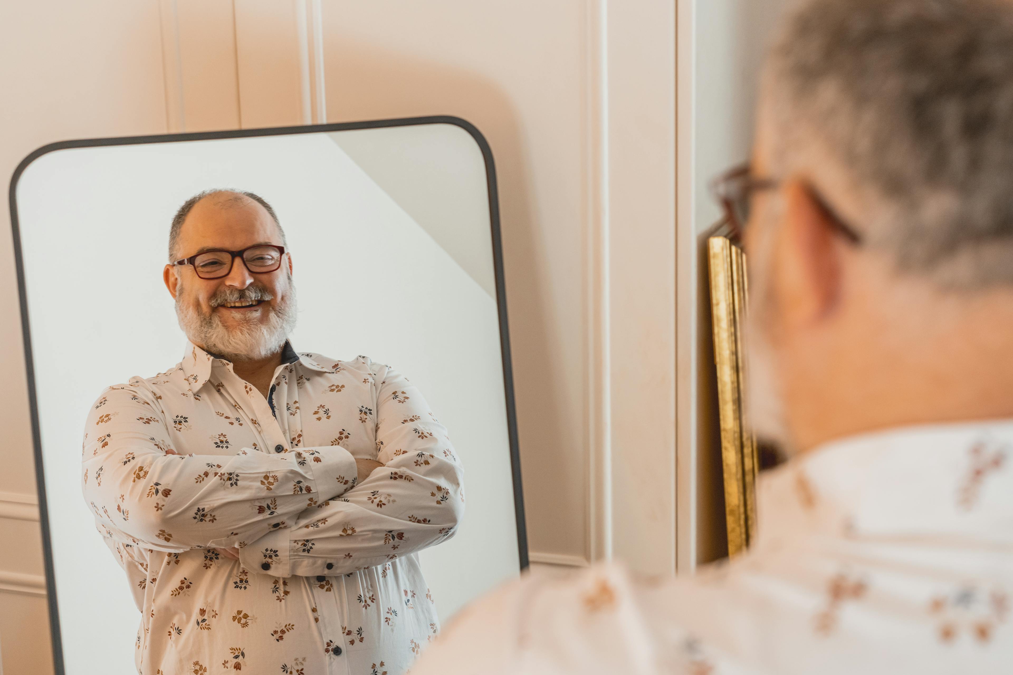 Man looking happy in the mirror