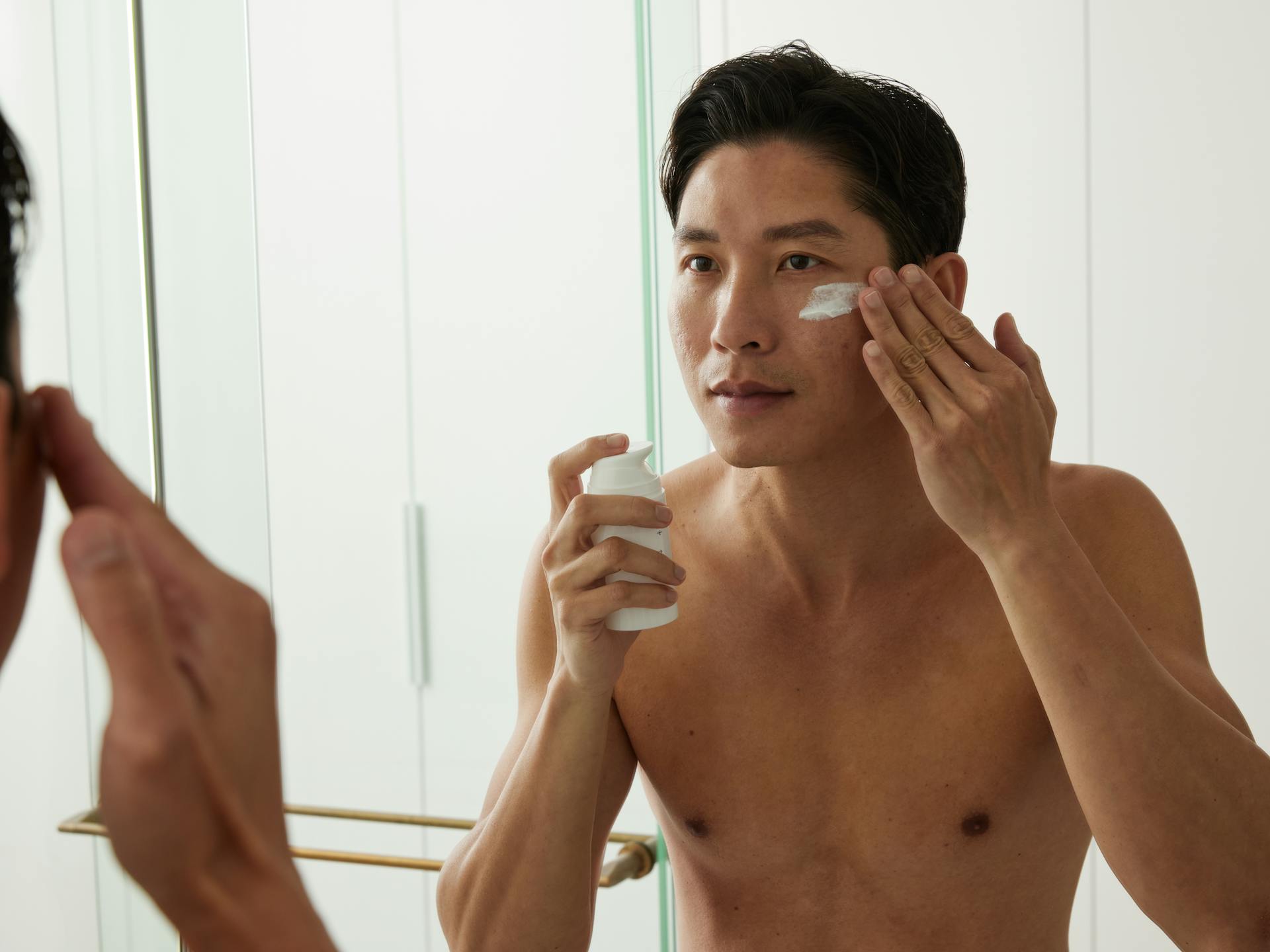 Man applying Mosh's Skincare treatment