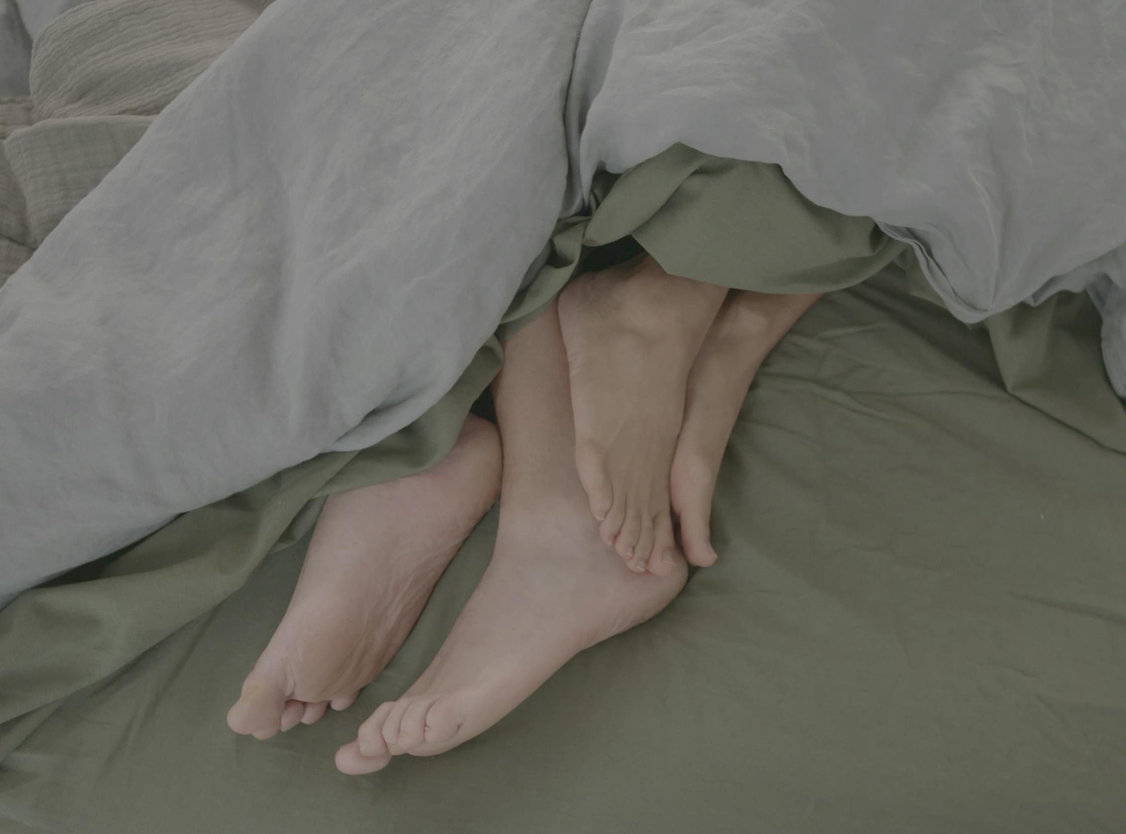 couple getting cozy in bed